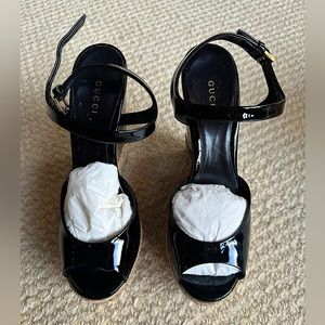 Gucci NWOB Patent sandals. Black patent. Elegant style. Never worn.